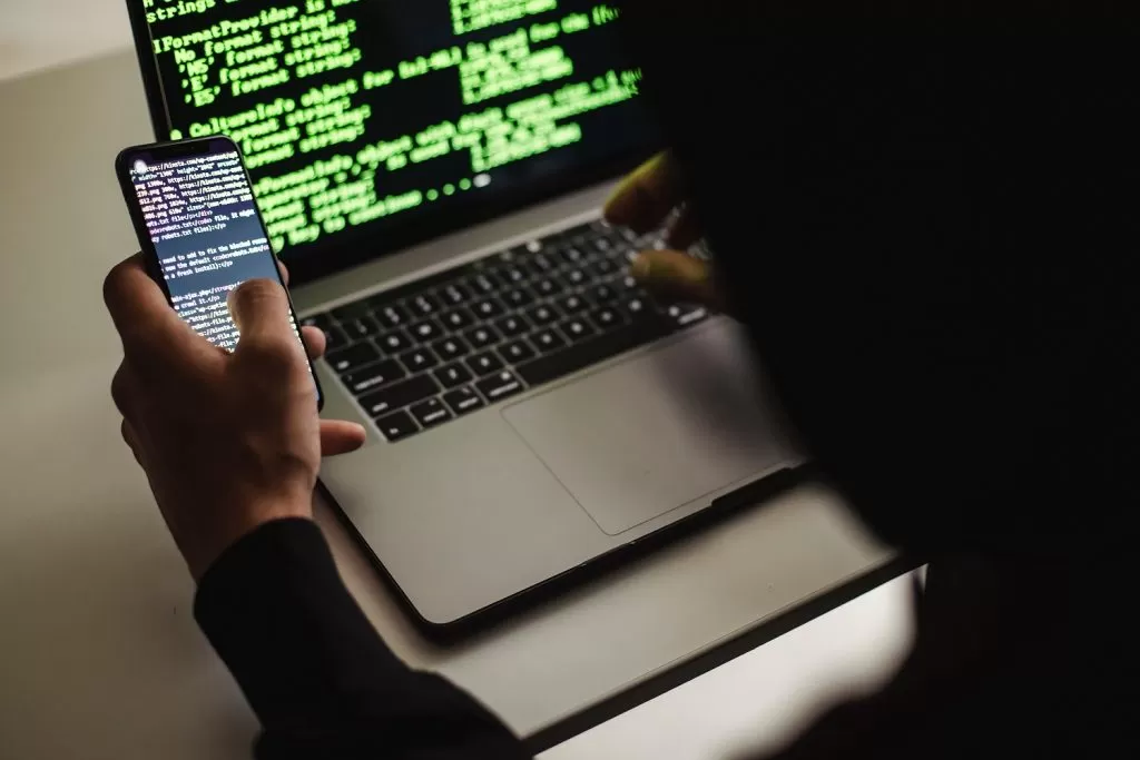 Developer coding and testing on his phone